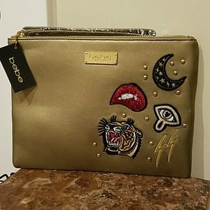 Sold.         Bebe clutch